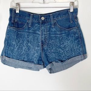 Levi’s orange tab cutoff shorts with swirl design